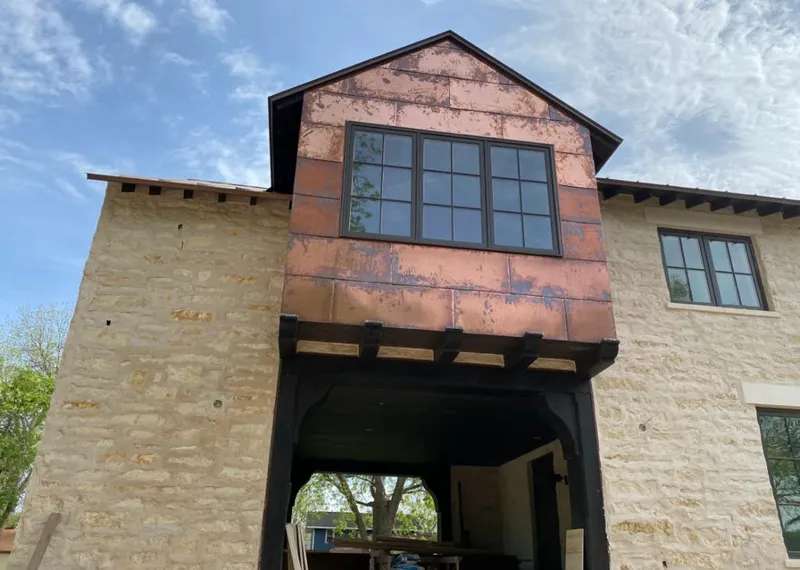 Copper metal panel facade on a stone building for Metal Roof Coating in South Barrington